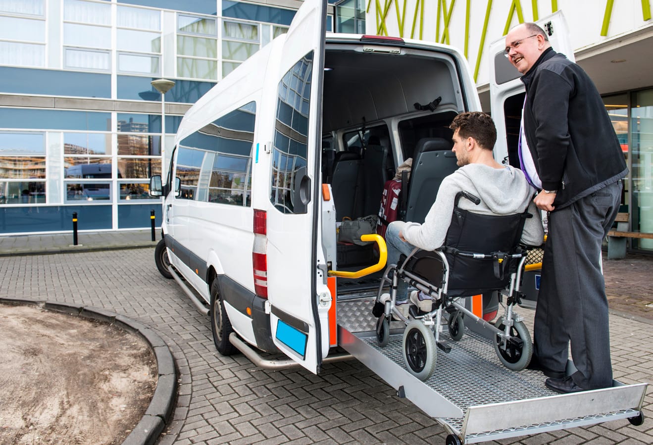Wheelchair user boarding a wheelchair accessible vehicle